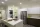 Kitchen with a refrigerator, washer, dryer, and an island.