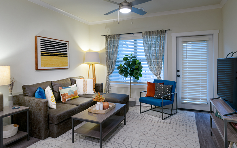 Living room with a large sofa, table, and chair.