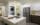 Kitchen with a refrigerator, washer, dryer, and an island.